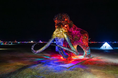 Illuminated Woolly Mammoth Sculpture at Burning Man Festival 2025の写真素材