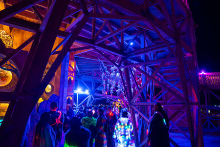 Nighttime Scene with Illuminated Wooden Structure at Burning Man 2025の写真素材