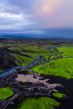 Aerial View of Icelandic Moss Landscape with Riverbeds and Hillsの写真素材