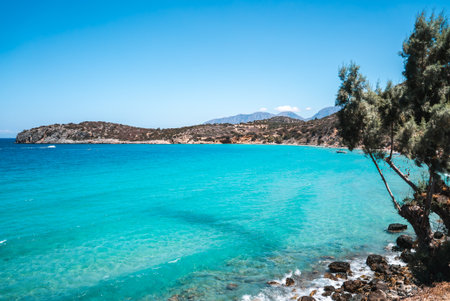 Coastal Scene with Turquoise Waters and Rocky Shoreline in Creteの写真素材