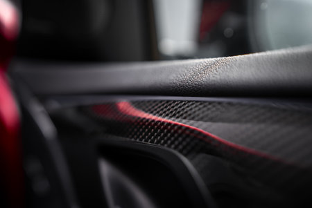 Close Up of X4 Door Panel with Carbon Fiber and Red Accentsの写真素材