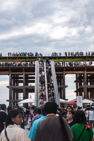 Crowds at Wooden Structure with Escalators at World Expo 2025, Osakaの写真素材
