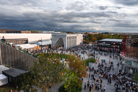 Crowds at World Expo 2025 with Modern Pavilion and Elevated Walkway