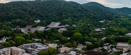 Aerial View of Kyoto with Historic Temples and Forested Hills