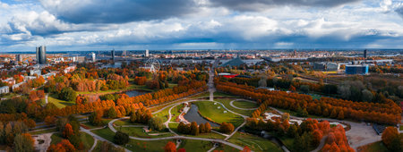 Golden autumn aerial of Riga with parks, bridges, and Old Town spiresの写真素材