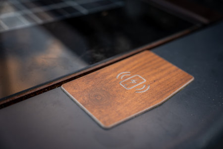 Wood trimmed wireless charging pad in luxury SUV center consoleの写真素材