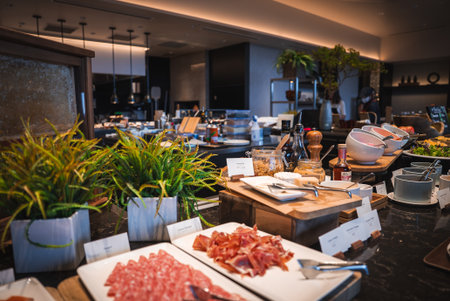 Luxury hotel buffet with charcuterie and cheeses in Japan dining areaの写真素材