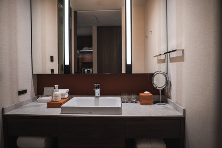 Contemporary hotel bathroom vanity with marble sink and mirrors in Japanの写真素材