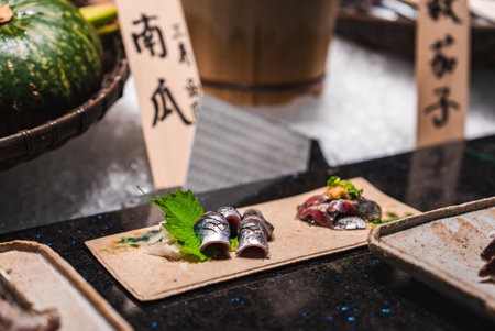 Close up sushi plating with silver fish and sashimi in Japan restaurantの写真素材