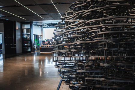 Modern interior with metal ribbon sculpture and linear light ceilingの写真素材