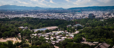 Aerial panorama of Nara Park and city with mountains beyond, Japan
