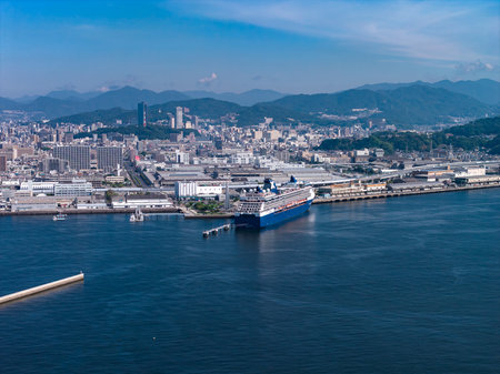 Aerial view of Hiroshima waterfront with cruise ship and mountainsの写真素材
