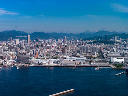 Aerial coastal skyline of Hiroshima, Japan with Chugoku Mountainsの写真素材