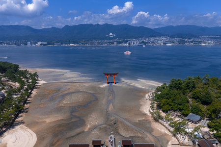 Aerial low tide view of Itsukushima Shrine torii in Hiroshima Bayの写真素材