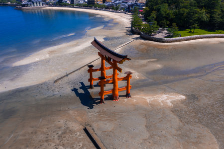 Aerial view of Itsukushima Shrine torii at low tide on Miyajimaの写真素材
