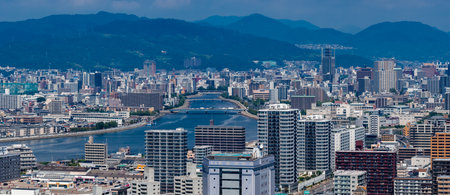 Aerial panorama of Hiroshima with river bridges and mountain backdropの写真素材