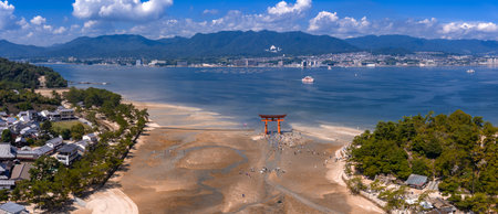 Aerial view of Itsukushima Shrine torii at low tide on Miyajimaの写真素材