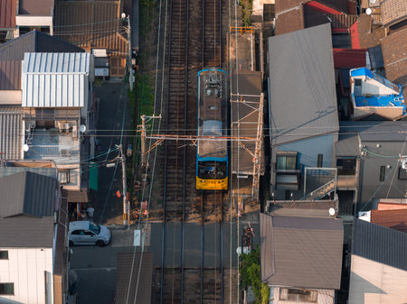 Aerial tram runs through tight residential blocks in Osaka, Japanの写真素材