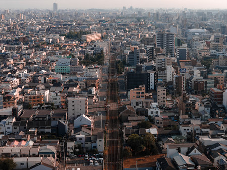 Aerial view of Osaka urban rail corridor and mid rise housing gridの写真素材