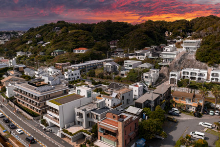Aerial view of Kamakura coastal neighborhood at sunset with hillsの写真素材