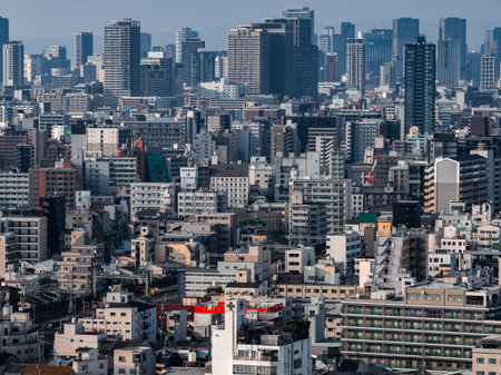 Osaka urban panorama with rail lines and modern high rises in daylightの写真素材