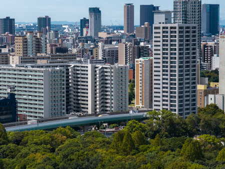 Aerial daytime view of central Osaka with parkland and expresswayの写真素材