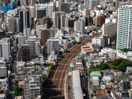 Aerial view of central Tokyo rail lines and compact neighborhoodsの写真素材
