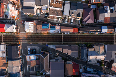Aerial view of Osaka neighborhood with parallel railway tracksの写真素材