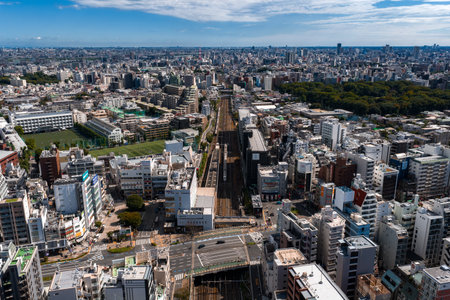 Aerial daytime view of Tokyo rail lines and Ueno Park adjacencyの写真素材