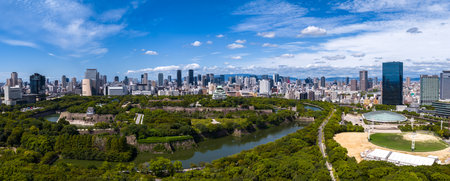 Aerial view of Osaka Castle Park and downtown skyline in Osakaの写真素材