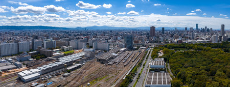 Aerial panorama of central Osaka with rail yard and Osaka Castle Parkの写真素材