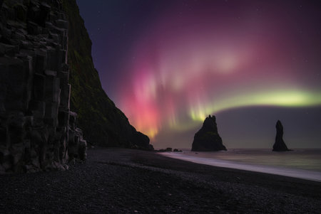Northern Lights over Reynisfjara and Reynisdrangar, Iceland at night