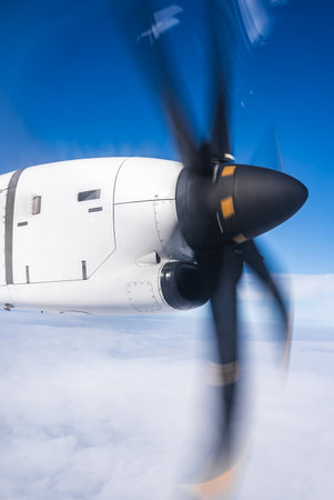 Turboprop engine spinning above clouds in Icelands daylight skiesの写真素材