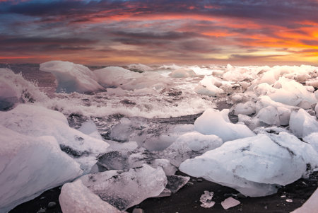 Ice shards on black sand at Diamond Beach, Jokulsarlon at dusk