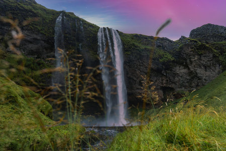 Seljalandsfoss like waterfall at twilight on Icelands South Coastの写真素材