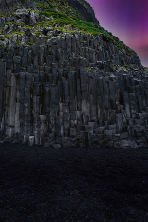 Basalt columns at Reynisfjara sea cliffs near Vik at dusk, Icelandの写真素材