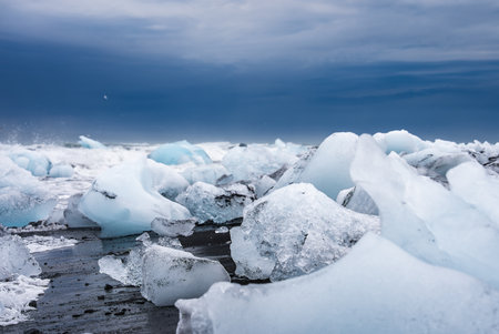 Ice fragments on black sand at Diamond Beach, Jokulsarlon, Iceland