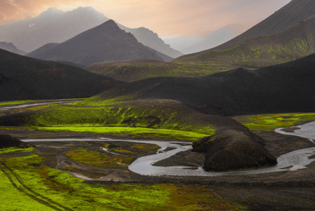 Serpentine river through volcanic hills near Landmannalaugar, Icelandの写真素材