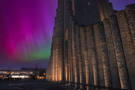 Hallgrimskirkja at night with aurora borealis over Reykjavik, Iceland