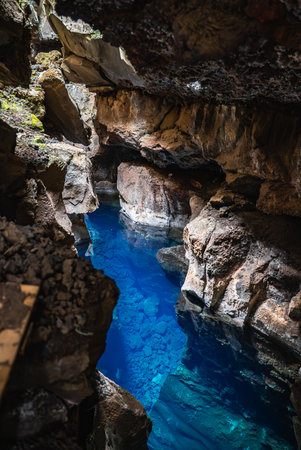 Iceland lava cave pool with basalt walls near Lake Myvatn, Icelandの写真素材
