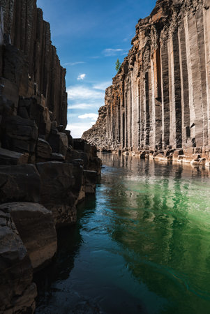 Studlagil Canyon basalt columns and turquoise river in East Icelandの写真素材