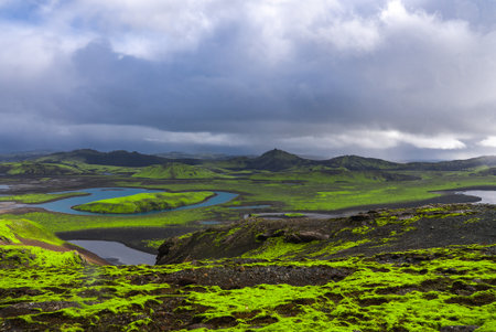 Glacial river through mossy volcanic plains in Iceland highlandsの写真素材