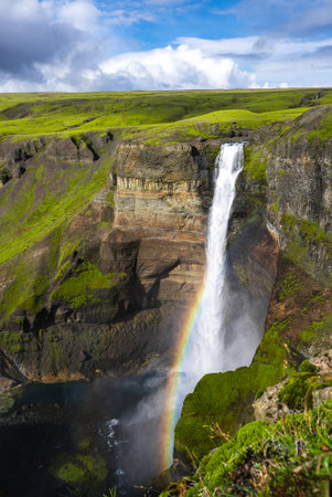 Haifoss waterfall with rainbow in Thjorsardalur Valley, Icelandの写真素材