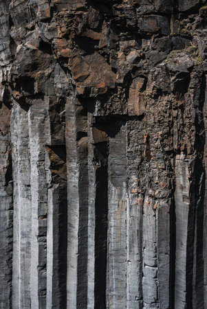 Basalt columns with hexagonal shafts on an Icelandic cliff face