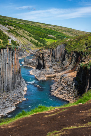 Studlagil Canyon basalt columns and turquoise river in East Iceland