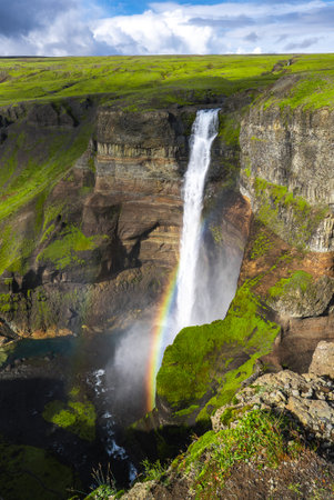 Haifoss waterfall and rainbow in Thjorsardalur valley, Icelandの写真素材