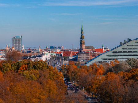Riga Old Town in golden autumn with St. Peters spireの写真素材
