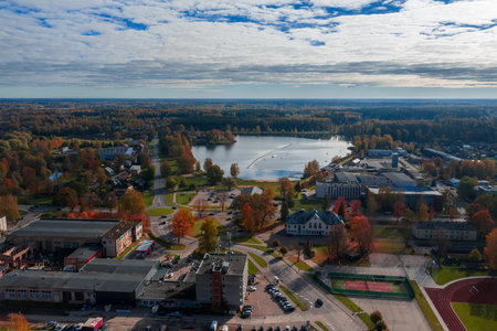 Aerial lakeside district of Jelgava, Latvia with pond and cable line