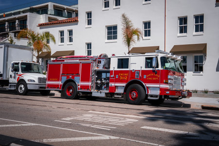 Santa Cruz Fire Engine 3112 parked along palm lined coastal streetの写真素材