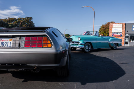 DeLorean DMC 12 and 1950s Chevrolet on Monterey street in daylightの写真素材